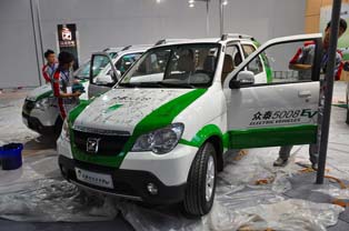Zotye 5008EV. 60,000 CNY subsidies available from the Chinese government and 50,000 CNY from Hangzhou city for purchase of the model. Max. speed: 100km. Capable of driving over 200 km on one charge.