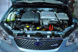 Engine bay of the BYD F3DM. Traction motor positioned next to the engine.