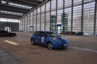 Test course set up in a corner of the exhibition site. Participants may take a test drive in 10 types of EVs and PHEVs, such as the Leaf, Prius and Volt.