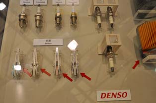 Display of Denso genuine spark plugs and pirated versions