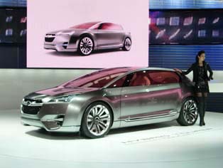 Subaru Hybrid Tourer Concept - development underway with plans for release in 2012, characterized by the direct injection turbo engine and electric motors mounted at both the front and rear.
